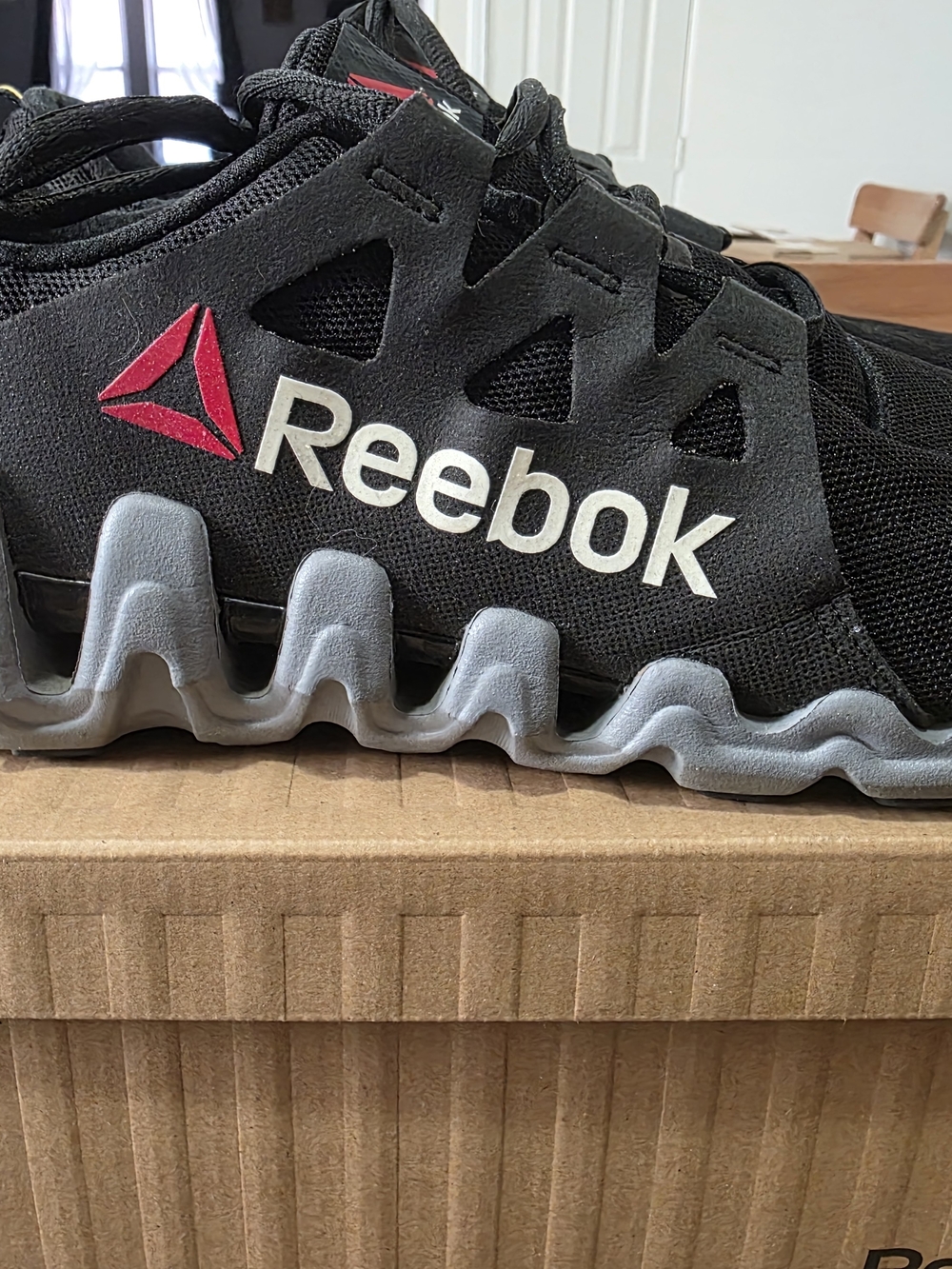 Reebok Black and Gray Zigtech Men's Athletic Shoes with Red Logo.slightly used.